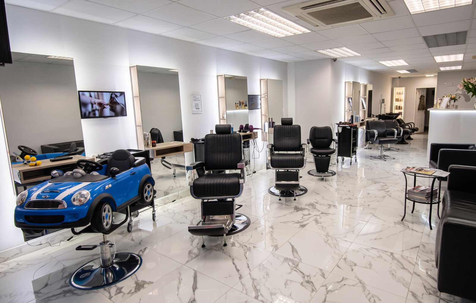 Interior of the Twickenham hair salon with barber chairs and styling stations